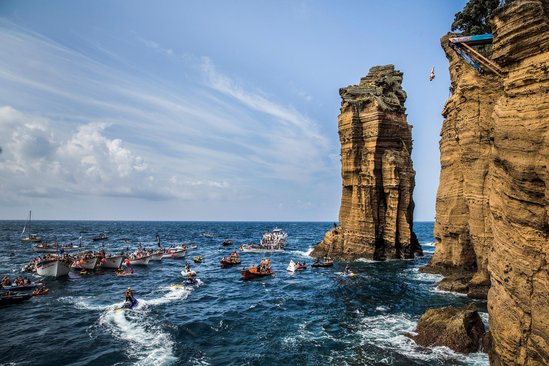 Andy Jones of the USA dives from the 27 metre platform on Islet Vila Franca do Campo during the fifth stop of the Red Bull Cliff Diving World Series, Azores, Portugal, on July 26th 2014.